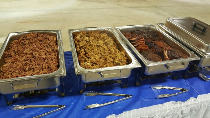 food in serving trays on table