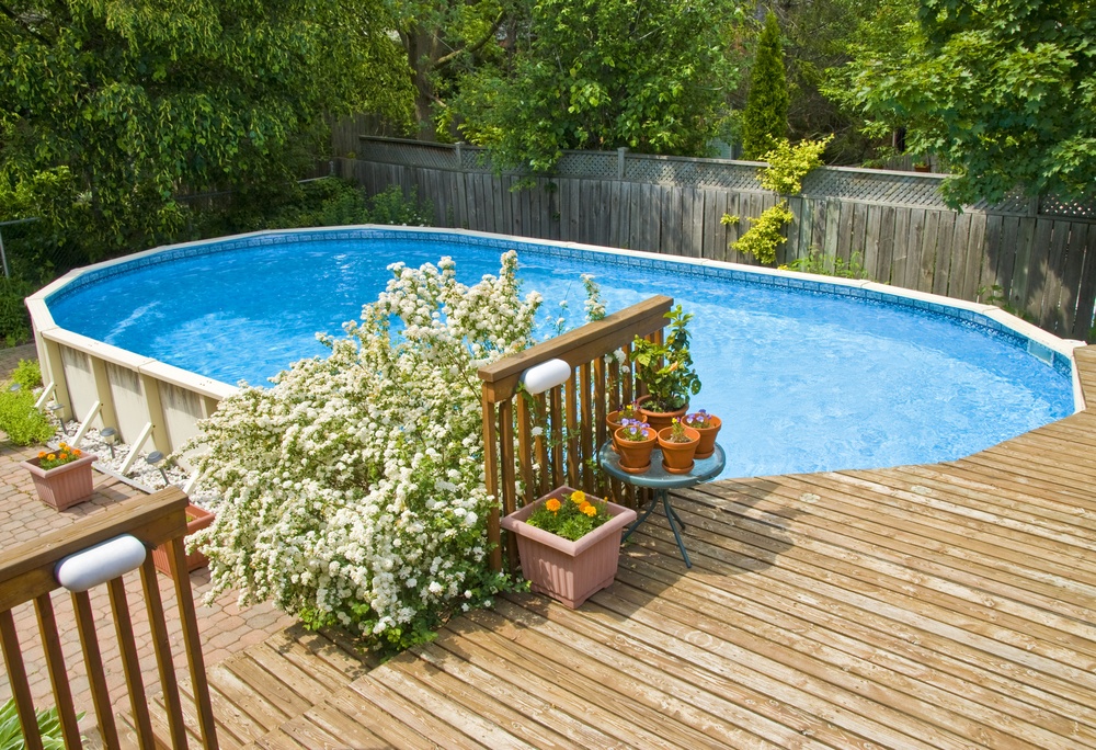 Above Ground pool and deck with plants 