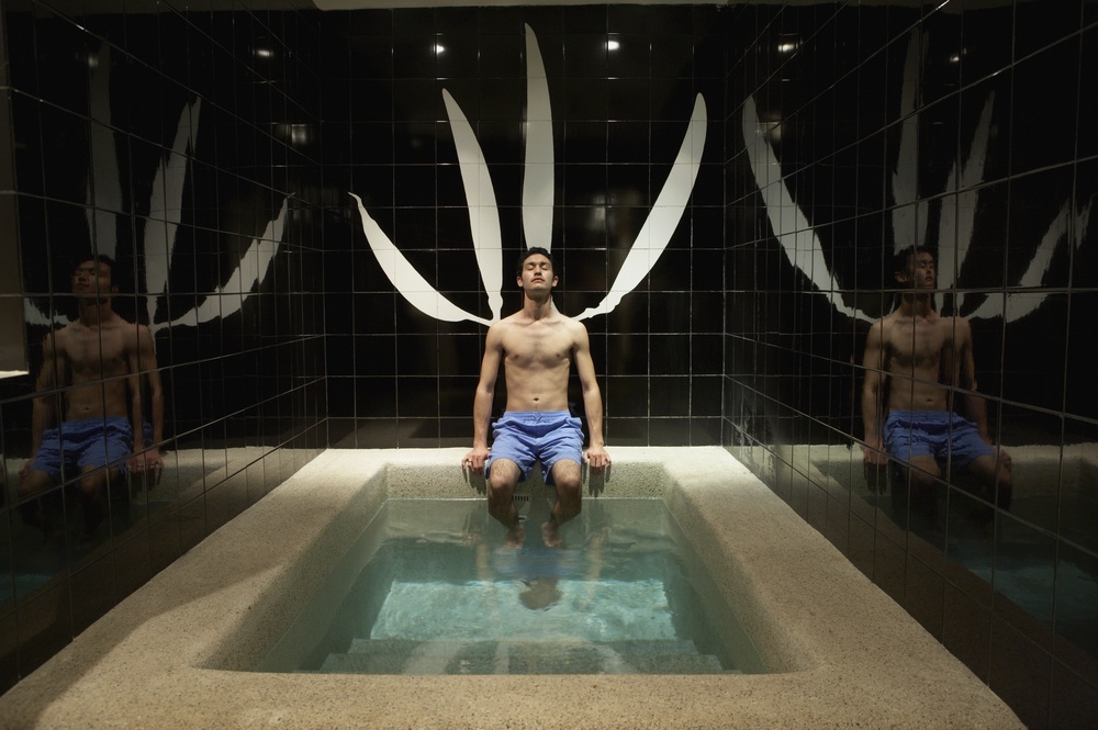 man relaxing in hot tub